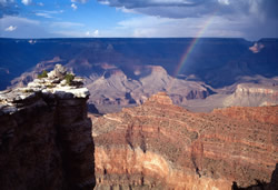 Afternoon thunderstorm produces a fantastic rainbow into the Grand Canyon!